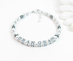 "Beaded Name Bracelet: Created with 4.5mm sterling silver alphabet blocks and loads of gorgeous sterling silver accent beads. The name on the bracelet can be hers, her child or grandchild's name, or something like Nana, Mimi, Grandma, Mommy, etc. The base price includes 6 letters. Each additional letter is $2. I can usually fit two names on the bracelet if desired. C H O O S E . Y O U R . C L A S P Twisted Heart Toggle Plain Heart Toggle Round Toggle Lobster Clasp with 1/2\" extender chain Arriv Silver Sterling Beaded Bracelets For Birthday, Anniversary Silver Beaded Bracelets, Silver Hypoallergenic Beaded Bracelets For Birthday, Mother's Day Silver Bracelets With Letter Beads, Personalized Sterling Silver Bracelets With Round Beads, Silver Beaded Bracelets With Letter Beads For Mother's Day, Silver Letter Beads Bracelet For Birthday, Classic Letter Beads Jewelry As Gift, Classic Letter Beads Jewelry Gift