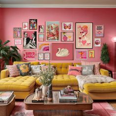 a living room filled with yellow couches and pictures on the wall above them,