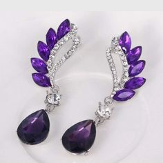 Vintage Flight Purple Gem Statement Earrings – Wicked Wonders Fairy Tale Jewelry, Cocktail Earrings, Purple Gems, Angel Wing Earrings, Trendy Fashion Jewelry, Vintage Frame, Long Dangle Earrings, Wing Earrings, Crystal Stud Earrings