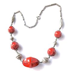 "Item: This is a 1930s silver tone necklace with nicely carved red wooden beads and beautifully etched metal beads. It's the kind of detailing which inspires so many people to collect vintage jewelry. Though unsigned I suspect this was made in Germany during the Bauhaus era. This is in Excellent condition and ready to wear. Be sure to Favorite this piece and check our other listings for lots more antique and vintage jewelry! Signature: Unsigned Measurements: 17\" total length Condition: 9.5 - Ex Vintage Silver Beaded Necklaces, Red Antique Engraved Necklace, Antique Red Engraved Necklace, Vintage Necklaces With Wooden Beads, Handmade Vintage Red Beaded Necklace, Red Vintage Necklace With 8mm Beads, Vintage Carved Round Beads Necklace, Red Carved Vintage Jewelry, Vintage Red Cabochon Necklace