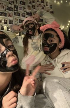 group of people with face masks posing for the camera