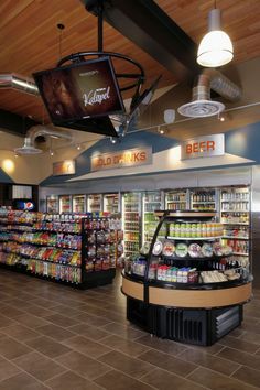 the inside of a grocery store filled with lots of food and drink bottles on display