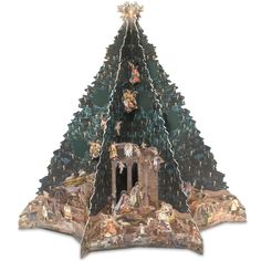 a christmas tree with nativity scene on top