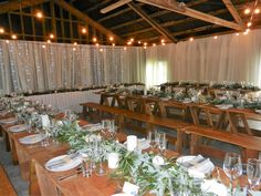 the tables are set up with place settings for guests to sit down and enjoy their meal