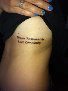 a woman's stomach with the words dream passionately love completely written on it