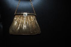 "Gatsby vintage 30s, liquid gold mesh, art deco, wedding, evening purse. Made by Whiting and Davis in USA. Closure with a lavish , clear rhinestones , exquisite clasp. One compartment with one open pocket lined with a salmon color satin. One , gold tone metal , ornate chain -small handle. Outstanding. Old Hollywood . Glamour. Runway. Look much better in person. Excellent condition. Very well preserved. Clean and strong inside and out. No any issue( true).No breaks in the mesh, no missing rhinest Gold Clutch Evening Bag For Cocktail, Glamorous Gold Evening Bag For Cocktail, Antique Gold Evening Bag For Formal Events, Antique Gold Evening Bag For Formal Occasions, Victorian Rectangular Evening Bag For Party, Antique Gold Bags For Party, Antique Clutch Evening Bag For Vintage Events, Antique Clutch Evening Bag For Party, Chic Gold Bags For Vintage Events