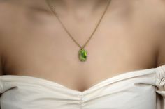 "Admire the gleaming elegance of this green stone necklace, boasting a marquise Peridot pendant and handcrafted with a 14k gold filled chain and prongs. This August birthstone jewelry is a timeless piece that you or a loved one can treasure and wear for years to come. ♥ Gemstone Type - Peridot (Lab Created) ♥ Gemstone Size - 12x22mm ♥ Gemstone Cut - Marquise - More options available in the drop down menu ♥ Metal Type (Main Photo) - 14k Gold Filled - More options available in the drop down menu ♥ Green Peridot Pendant Necklace, Elegant Green Marquise Necklace, Green Marquise Jewelry For May Birthstone, Green Marquise May Birthstone Jewelry, Green Marquise Birthstone Jewelry, Green Oval Necklace For Wedding, Formal Green Marquise Jewelry, Green Oval Birthstone Necklaces, Green Teardrop Pendant Necklace For Wedding