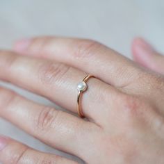 D E T A I L This dainty ring comes with a real fresh water pearl. The minimal pearl ring can be used as a stackable ring to compliment other accent rings.  Each ring is handmade by myself. The metal is 14k gold filled which the base is a different metal covered with multiple layers of 14k gold.  P A C K A G I N G Each item is nicely packaged as a gift. All material used are eco friendly and recyclable products. P R O D U C T I O N  Our current production time is 1-3 business days + ship time. Once your order has been handmade and shipped out, it will take 2-5 business days to get from us to you if you're within the US, and 2-4 weeks if you're outside of the US! Pearl Stacking Ring, Accent Rings, Ring Minimal, Gold Pearl Ring, Wedding Picture Poses, Wedding Picture, Fresh Water Pearl, Stackable Ring, Dainty Ring