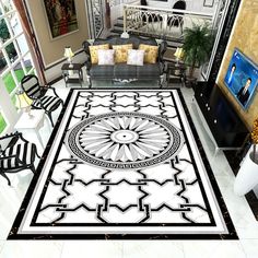 a black and white rug in the middle of a living room