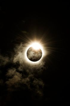 the solar eclipse is seen through clouds in this photo taken on july 29, 2012