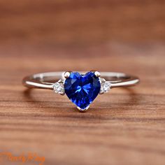 Heart Blue Cubic Zirconia Sterling Silver Ring, Simulated September Birthstone Sapphire Color CZ Sterling Silver Girls Teens Womens Ring ▷Gift Box Included ▷7mm Height ▷Size 3 - 12 Available ▷925 Sterling Silver (not plated or filled) ▷925 Stamp Authenticity ▷High-Quality Cubic Zirconia Used https://www.etsy.com/shop/TrendyRing Womens Ring, Sapphire Color, September Birthstone, Cute Rings, Ring Gift, Sterling Silver Ring, Women Rings, Band Rings, Birthstone