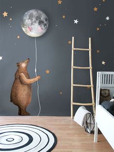 a teddy bear is flying in the air with a balloon attached to it's back