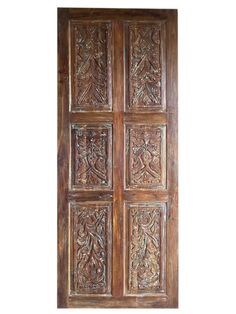 an old wooden door with carvings on it