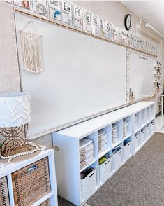 a whiteboard and some baskets in a room