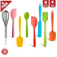 colorful kitchen utensils and spatulas on white background