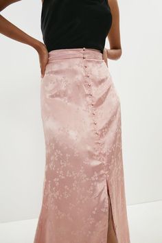 Borrowing from vintage styles, this silky satin midi skirt is at once both feminine and refined. Its tonal floral pattern and fabric-covered buttons add a romantic touch to this fluid, flirtatious design.Style: Midi SkirtFabric: SatinLength: Midi Skirts Satin, Satin Skirts, Latest Skirts, Satin Midi Skirt, Fabric Covered Button, Satin Skirt, Pink Skirt, Boutique Brands, Pink Satin