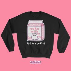 A soft but sturdy sweatshirt with a cute carton of pink kitty cat milk. This sweater looks great on both men and women. Perfect for people who love kawaii clothing and being cozy. Runs large for women, order your regular size for an oversized look, order a size down for a more fitted look. Fits men true to size. Plus sizes available! Pre-shrunk Runs large for women Classic fit Reduced pilling Double-needle stitching throughout Sizing tip: Take a sweatshirt or tee that fits you the way you like, Cute Long Sleeve Sweatshirt With Cat Design, Cute Long Sleeve Sweatshirt With Cat Print, Hello Kitty Cotton Sweatshirt In Kawaii Style, Cute Cotton Sweatshirt With Hello Kitty Print, Cute Cotton Sweatshirt With Cat Design, Cute Hello Kitty Print Crew Neck Sweatshirt, Kawaii Long Sleeve Top With Cat Design, Pink Hello Kitty Print Crew Neck Sweatshirt, Cute Crew Neck Sweatshirt With Cat Design