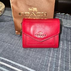 This A Brand New, Closet Kept, Never Used Compact Wallet By Coach. The Leather Is Flawless (With The Exception Of Minor Flaking In The Inside, Pictured), As Well As The Charms, No Scratches, No Tarnishing. Smoke Free Coach Red Bifold Wallet, Red Coach Leather Wallet, Red Leather Coach Wallet, Coach Red Wallet With Removable Pouch, Red Coach Wallet With Removable Pouch, Coach Coin Purse, Red Charm, New Closet, Banana Print