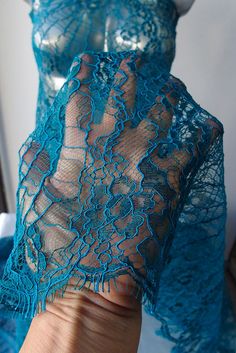 French lace in a rich teal blue. Has scalloped edge with eyelashes on both sides. Suitable for mother of bride, formal, party, cocktail, evening, formal, red carpet dress. Country of manufacture France. Brand Solstiss. WIDTH: 95cm Piece is per running meter. Blue Lace Trim Dress For Wedding, Blue Lace Trim Wedding Dress, Blue Lace For Wedding, Blue Lace With Lace Trim For Wedding, Scalloped Stretch Lace For Party, Blue Lace Patchwork For Wedding, Blue Lace Patchwork For Party, Blue Lace With Patchwork For Party, Blue Lace Patchwork Dress For Party