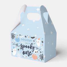 a blue halloween treat box with white stars and spooky one on the front