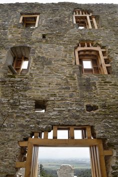 an old stone building with several windows in it