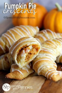 pumpkin pie crescents on a cutting board with oranges in the background and text overlay