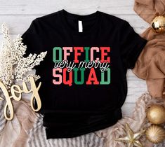 Very Merry Office Squad Shirt, Christmas Office Staff T-Shirt, Xmas Office Team 2024 Shirts, Office Crew Sweatshirt, Office Party Christmas  Welcome to BelinayShirt,  Your ultimate destination for unique and stylish printed t-shirts! At BelinayShirt, we believe in expressing individuality through fashion. Our collection features a wide range of designs, from trendy graphics and bold statements to artistic prints and personalized options. Each shirt is crafted with high-quality materials to ensure comfort and durability. Whether you're looking to make a fashion statement or find the perfect gift, BelinayShirt has something for everyone. Discover your new favorite tee today and wear your personality with pride! Christmas Office Shirts, Volunteer Shirt, Trendy Graphics, Office Team, Bold Statements, Office Staff, The Office Shirts, Squad Shirt, Office Party