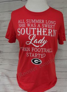 a red shirt that says, all summer long she was a sweet southern lady when football started