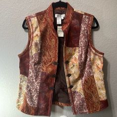 New Coldwater Creek Fall Rust Brocade Vest | Antique Brass Clasp| Size Medium Condition: New W/Tags (Nwt) New To Poshmark? Get $10 Off Your First Purchase When You Use Code: Texasdrawers Shipping- 24 To 48 Hours Smoke/Pet Free Home 5 Star Seller Tags: Preowned , Used , Versatile, Transitional, Universal, Everyday, Casual, Classic, Timeless, Neutral, Holiday, Birthday, Christmas, Xmas, Staple, Utility, Loungewear, Functional, Work, Capsule, Gift, Buttery, Soft, Cozy, Light, Core, Dressy, Modest, Brocade Vest, Preppy Travel, Work Capsule, Coldwater Creek, Holiday Birthday, Antique Brass, 5 Star, Lounge Wear, Jackets & Coats