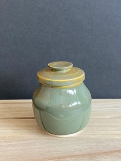 Enhance your home decor with this beautifully handcrafted jade/green lidded jar. Standing at approximately 4.5 to 5 inches tall with the lid, this charming jar combines functionality with artistic craftsmanship. The jar's opening measures almost 3 inches, making it perfect for storing small items or simply serving as a decorative accent. The jar features a stunning jade green glaze that exudes elegance and tranquility. While the bottom of the jar has some glaze imperfections, these are only visi Jars With Lids, Jar Lids, Jar Containers, Jade Green, Fine Art Ceramics, Small Items, Decorative Pieces, Thoughtful Gifts, Unique Pieces