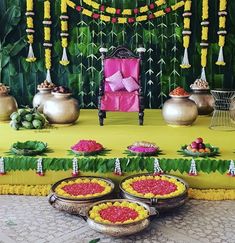 a decorated stage with flowers and potted plants