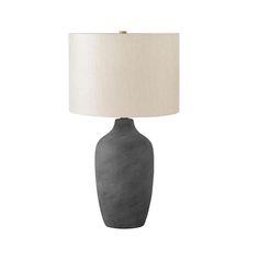 a gray table lamp with a white shade