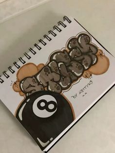 a spiral notebook with an image of koalas on it