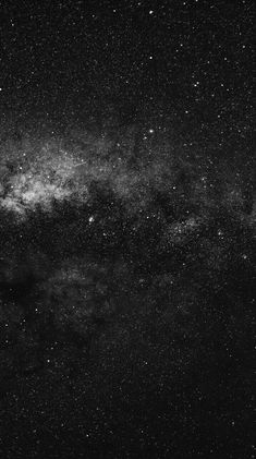 black and white photograph of the night sky with stars in it, as seen from space