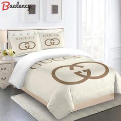 a bed with white and brown comforters in a room