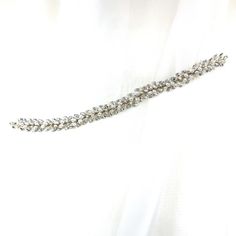 A clean cut vine of glistening crystals, this bridal hair vine radiates class and elegance. It is a simplistic way to elevate your bridal hairstyle and add a sweet sparkle to your look. Its soft and flexible structure makes this the perfect accent for many different hairstyles. Available in all crystal or crystal with pearl detailing. -Genuine crystals -Approximately 0.6in from widest point x 11.4in long (1.5cm x 29cm) -Rhodium plated non-tarnish finish for brilliance -Light and flexible for eas Adjustable Crystal Embellished Hair Accessories For Weddings, Wedding Crystal Hair Accessories With Rhinestones, Wedding Hair Accessories With Rhinestones And Crystal, Elegant Silver Crystal Hair Accessories, Silver Crystal Hair Accessories For Wedding, Wedding Hair Accessories With Rhinestones, Elegant Silver Hair Accessories With Rhinestones, Crystal Wedding Hair Accessories, Bridal Hairstyle