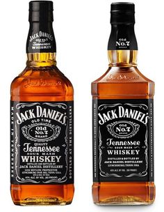 three bottles of jack daniels whiskey on a white background