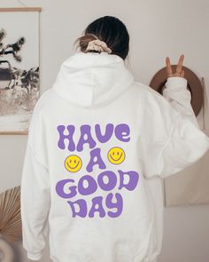 Have A Good Day Sweatshirt, Smiley Face Sweater, Positive Quote Hoodie, Good Energy Sweater, Aesthetic Hoodie, Words On Back Sweatshirt Hi all, welcome to the Comfy Tee Design, It's so nice to see you here. If you are looking for soft, comfy and high quality sweatshirts, I have good news for you: You're at the right place!  Sweatshirts are unisex sizing. It's proper, comfortable and flattering for men and women, but may run  large for the ladies. Please see the size chart to find your perfect fi Smiley Hoodie, White Hoodie With Lettering For Fall, White Hooded Hoodie With Lettering, White Long Sleeve Hoodie With Lettering, White Hoodie With Lettering In Relaxed Fit, Trendy Cotton Hoodie With Lettering, Casual White Hoodie With Lettering, White Cotton Hoodie With Lettering, Aesthetic Hoodie