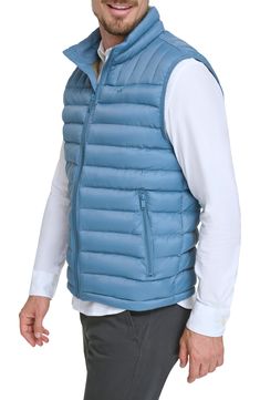 A quilted stand collar and lightweight fill insulate this heat-keeping puffer vest. 26 1/2" length (size Medium) Stand collar Front zip closure Front zip pockets Water resistant 100% nylon Machine wash, tumble dry Imported Blue Puffer Jacket With Pockets For Outdoor, Outdoor Nylon Vest With Padded Collar, Royal Blue Puffer Vest, Blue Nylon Puffer Outerwear, Outdoor Nylon Puffer Vest, Festival Must Haves, Prom Shopping, Ted Baker London, Cozy Gift