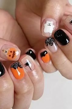 These Black Halloween Nails Are Blowing Up on Pinterest! Make your Holloween Nails unforgettable! Get ready to be inspired by these stunning Black Halloween Nails that are perfect for the spooky season! From Pink Halloween Nails and Purple Halloween Nails to fun Pumpkin Nails, these designs will elevate your nail game. Try out creative Halloween Press On Nails or go for intricate Nail Art Halloween featuring Bat Nails. Whether you’re looking for Cute Halloween Nails or bold Halloween Acrylic ... Ghost Nails Short, Korean Halloween, Halloween Ghost Nails, Halloween Nail Colors, Nail Designs For Short Nails