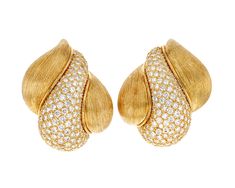 These earrings by legendary American jewelry designer Henry Dunay are a balance of drama and elegance. The 18K yellow gold setting is texturized with Dunay's signature "Sabi" etching technique, which adds an intriguing surface detail. The softly rounded curves of the textured gold are accented with approximately 8.00 carats of white diamonds. Luxury Pierced Yellow Gold Jewelry, Modern Luxury Earrings With Gold-tone Hardware, Luxury Yellow Gold Brass Earrings, Luxury Gold Plated Round Danglers, Luxury Fine Jewelry Earrings In Recycled Gold, Luxury Elegant Earrings With Gold-tone Hardware, Elegant Luxury Earrings In Recycled Gold, Luxury Yellow Gold Statement Earrings, Luxury Gold Plated Earrings For Statement Occasion