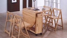 a wooden table with four chairs around it