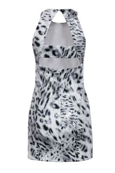 Get wild and sparkly in this Parker sequin grey and white leopard print dress. With a high neck and cut out back detail, this sleeveless dress is perfect for a girls' night out in Vegas or a bachelorette party in Miami. Style it with strappy heels for a fun and fearless look. Size M Shell 95% Polyester, 5% Spandex Lining 97% Polyester, 3% Spandex Invisible side zipper Cut out back details Sleeveless High neckline Bust 34" Waist 28" Shoulder to hem 34" Night Out In Vegas, Miami Style, White Leopard Print, Parker Dress, White Leopard, Out Back, Leopard Print Dress, Girls Night Out, High Neckline