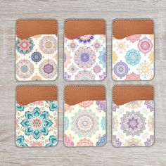 four coasters with different designs on them, one has a pocket for the phone