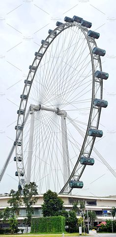 a ferris wheel in front of a building