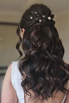 Romantic cascading chocolate curls adorned with elegant pearl accents in a volumized half-uphalf-down hairstyle exuding drama and charmideal for special occasionsPhoto CreditInstagram @d__hairstylist Prom Pearl Hairstyles, Half Up Half Down Hair With Accessories, Hairstyles Formal Elegant Down, Pearly Hairstyle, Prom Night Hairstyle Soft Curls, Wedding Hairstyles Half Up Half Down Medium Length Dark Hair, Half Up Half Down Pearl Hair, Half Up Hair Formal, Half Up Half Down Pearls