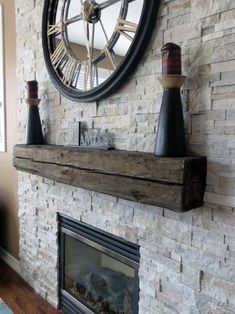 a clock mounted to the side of a brick wall next to a fireplace in a living room