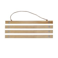 three wooden signs hanging from a rope on a white wall with two holes in the middle