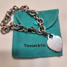 Authentic Tiffany And Co. Heart Bracelet Sterling Silver 925 Comes With Original Bag But No Box. Open To Offers. Classic Sterling Silver Bracelet For Valentine's Day Gift, Luxury Silver Heart Cut Bracelet, Classic Sterling Silver Bracelet With Heart Charm For Gift, Designer Sterling Silver Bracelet For Gift, Designer Sterling Silver Bracelet As Gift, Elegant Heart Shaped Bracelets With Sterling Silver Clasp, Elegant Heart Bracelet With Sterling Silver Clasp, Elegant Heart-shaped Sterling Silver Bracelet For Formal Occasions, Heart-shaped Engraved Bracelets For Formal Occasions