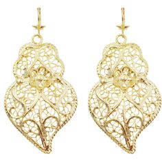 Features: Made in Portugal: Crafted with care and tradition, ensuring high-quality artistry and authenticity. Filigree Metal Construction: Features intricate filigree work that showcases a delicate and detailed design, adding elegance to any outfit. Elegant Gold Color: The stunning gold hue enhances the beauty of the earrings, making them a versatile accessory for both casual and formal occasions. Unique Viana Heart Design: Inspired by the iconic Viana heart, symbolizing love and tradition, thes Traditional Heart-shaped Jewelry For Festive Occasions, Traditional Gold Heart Jewelry, Traditional Gold Heart-shaped Jewelry, Ornate Bridal Drop Earrings With Intricate Design, Ornate Chandelier Earrings With Intricate Design For Anniversary, Traditional Gift Heart Earrings Pierced, Gold Elegant Heart Earrings, Elegant Gold Heart Pierced Earrings, Elegant Gold Heart Earrings